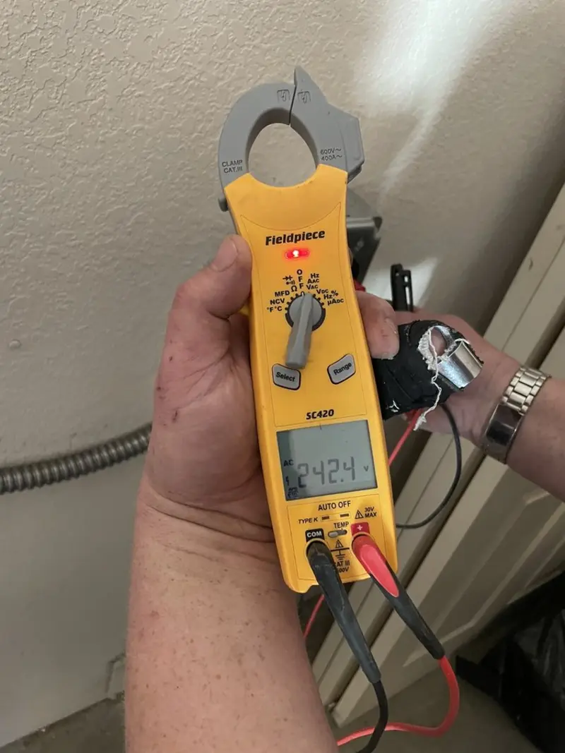 Voltage testing with clamp meter during Ceiling Fan Installation in Jefferson